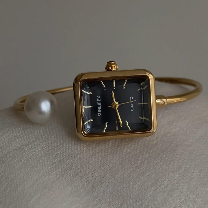 Noir Pearl – Relógio de pulso com pulseira rígida em preto e dourado, elegante