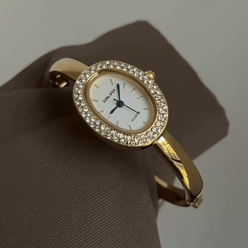 Relógio feminino dourado com bracelete rígido oval com cristal – mostrador branco elegante
