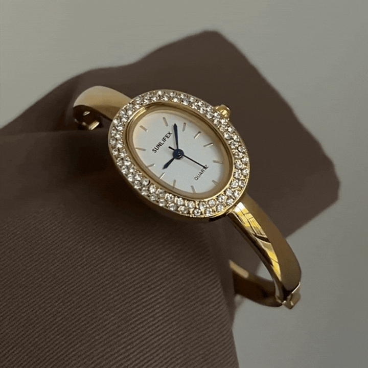 Relógio feminino dourado com bracelete rígido oval com cristal – mostrador branco elegante