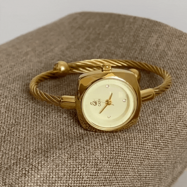 Relógio-jóia minimalista dourado com pulseira rígida e mostrador redondo para mulheres